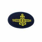 Patch oval azul marinho com âncora central, círculo com T e faixas amarelas