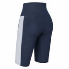 Bermudas esportivas femininas azul marinho com faixa lateral cinza, cintura alta.